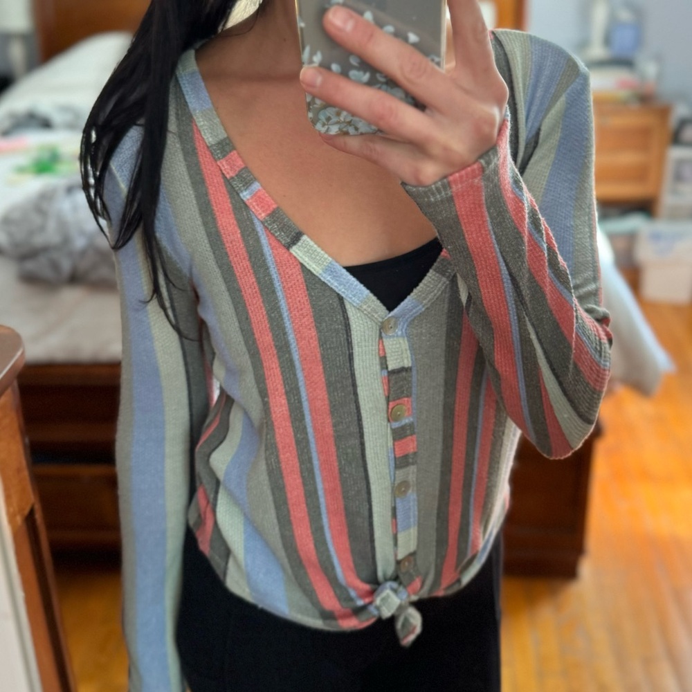 Colorful top with tie accent.